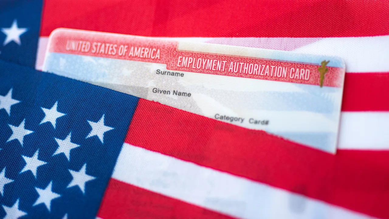 Employment authorization card and US flag