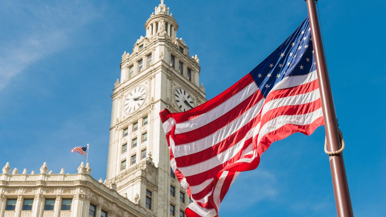 a US flag and parliament building