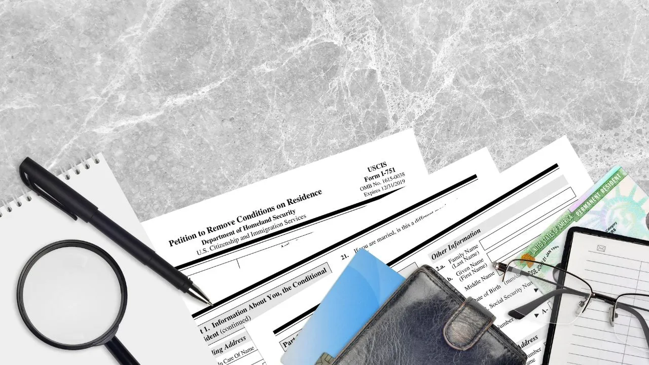 i751 form with a bunch of other immigration forms on a table