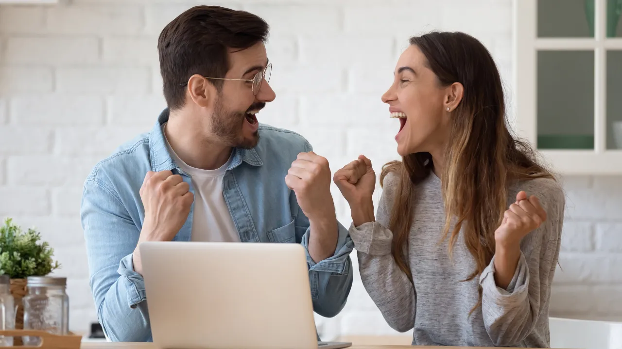 A couple celebrating good news