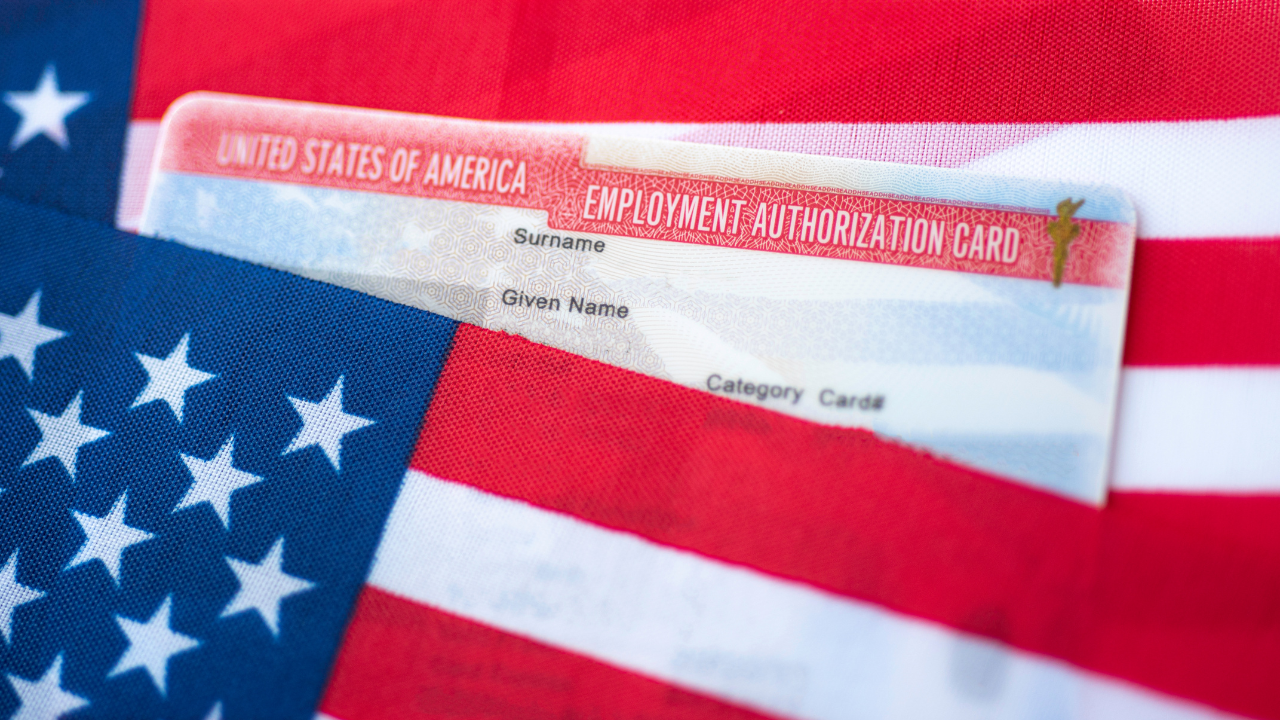 Employment authorization card and US flag