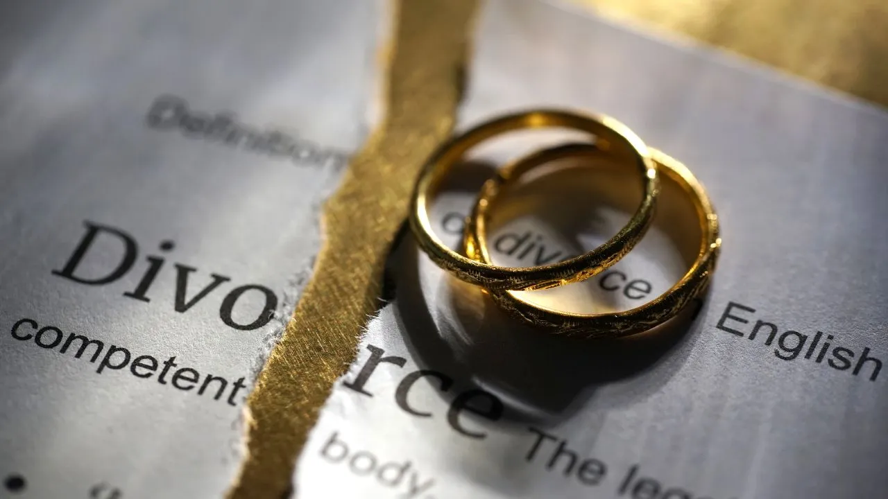 Divorce papers and rings on a table