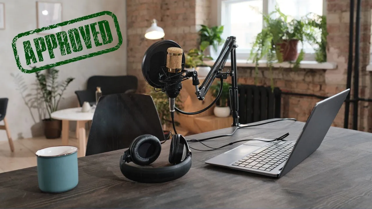 A podcast station set up with an approval stamp over it