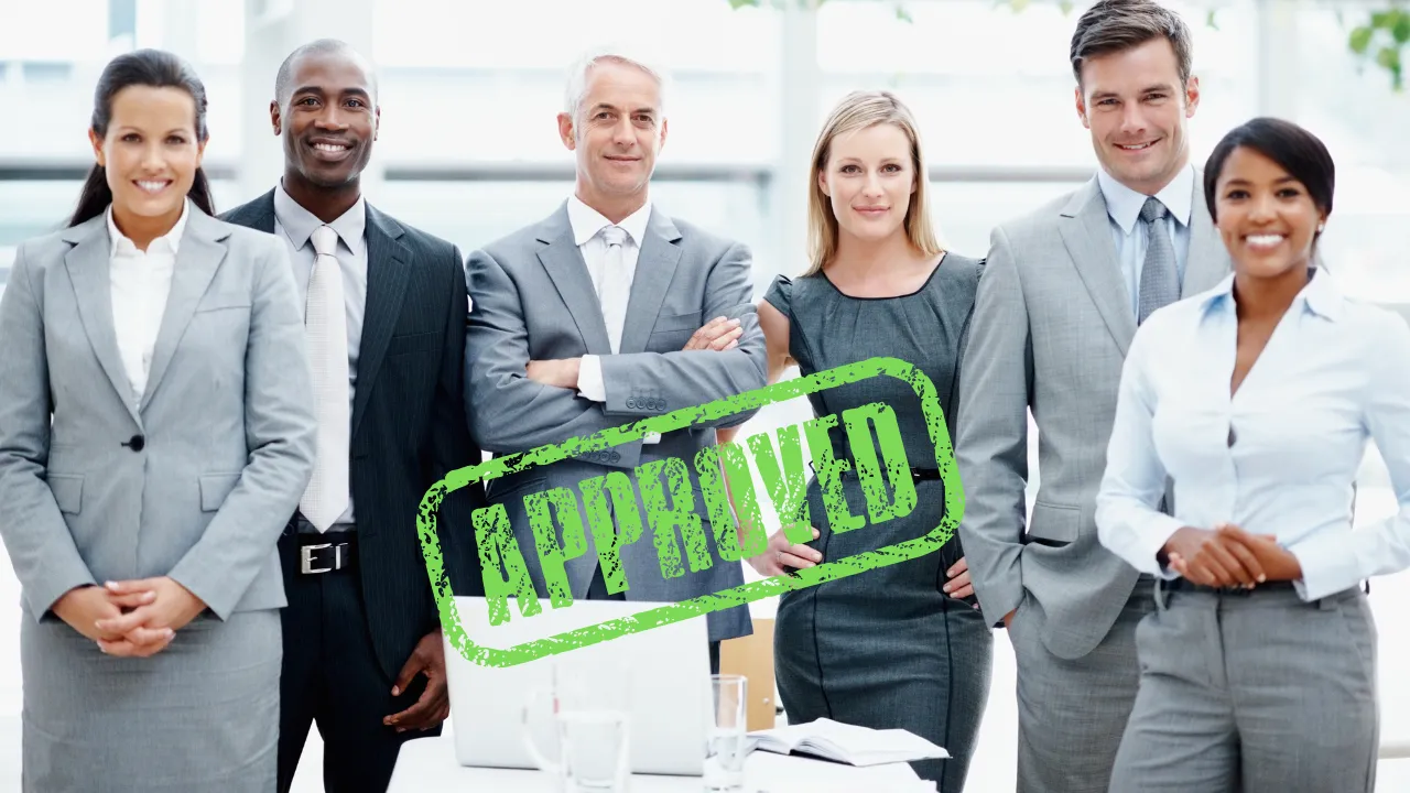 A group of executives and an approved stamp