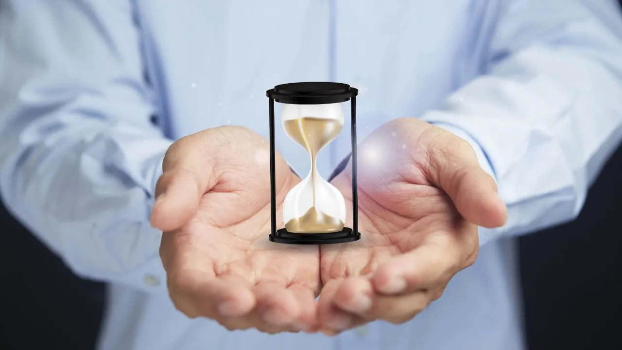 A man holding an hour glass