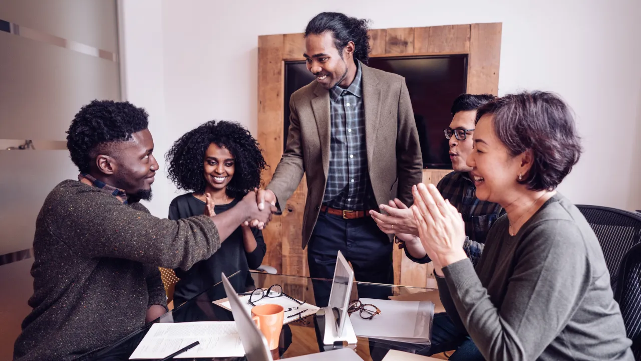 A group of people in a recruiting agency meeting in an office