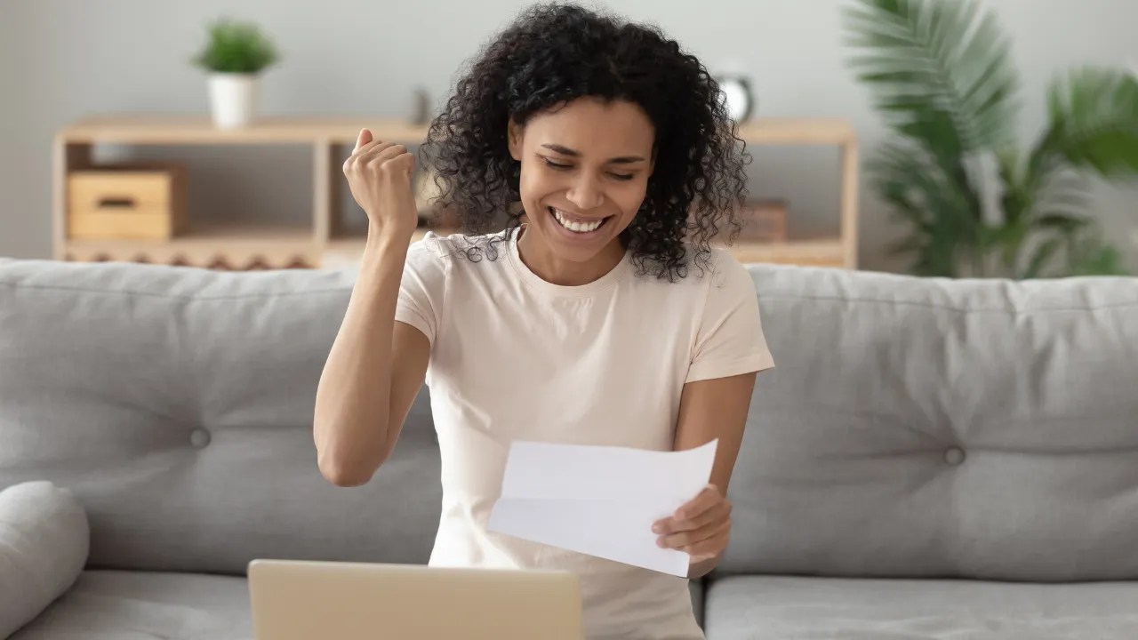 A woman celebrating a win and good news