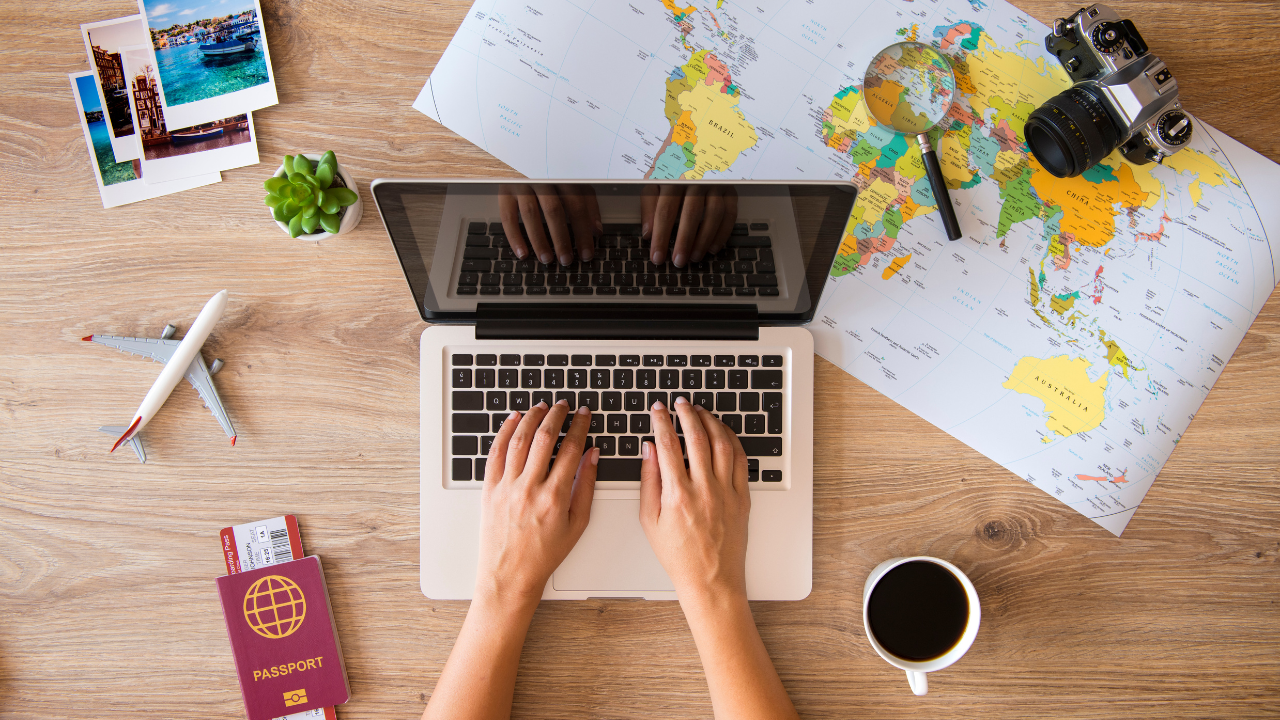 Someone working on a laptop while travelling