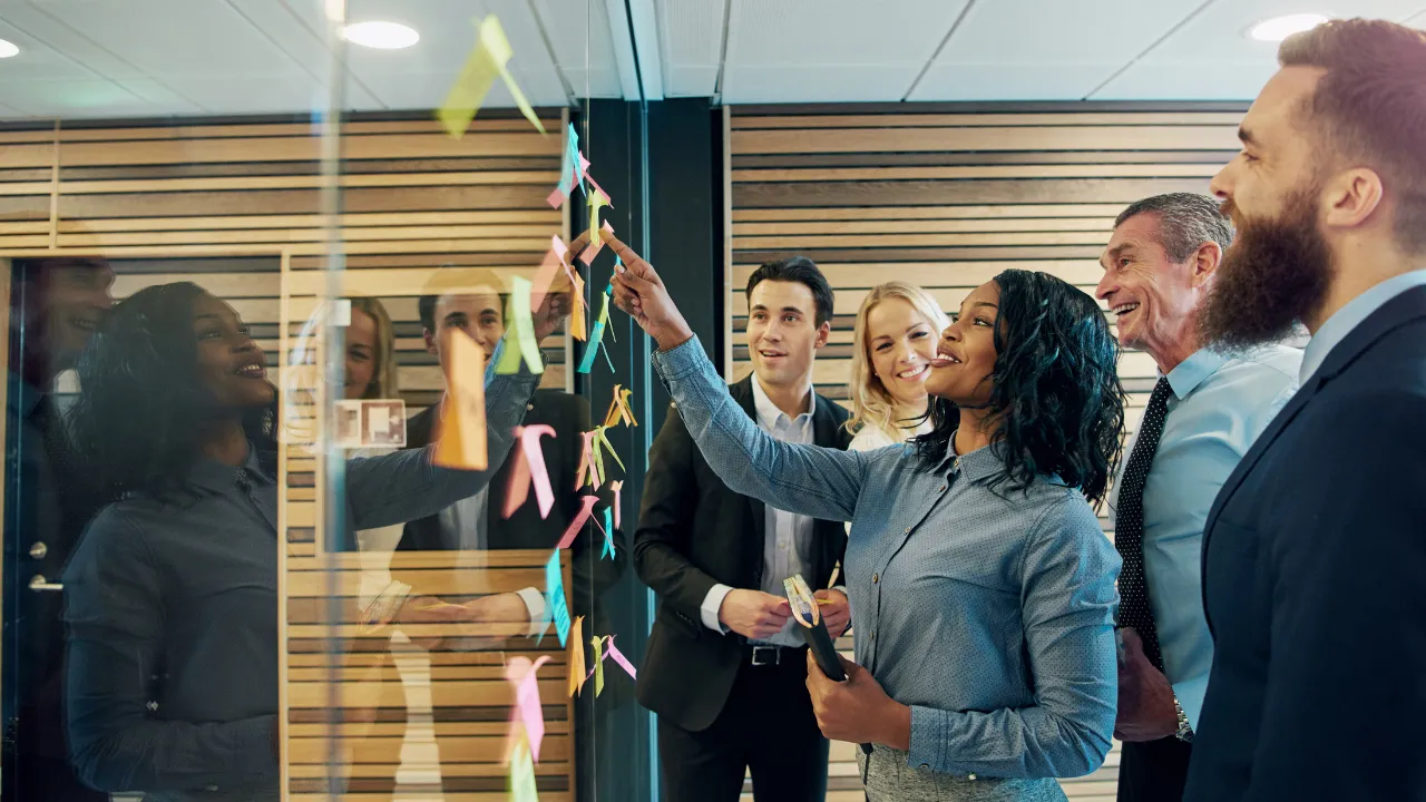 A group of entrepreneurs gathered in a board room