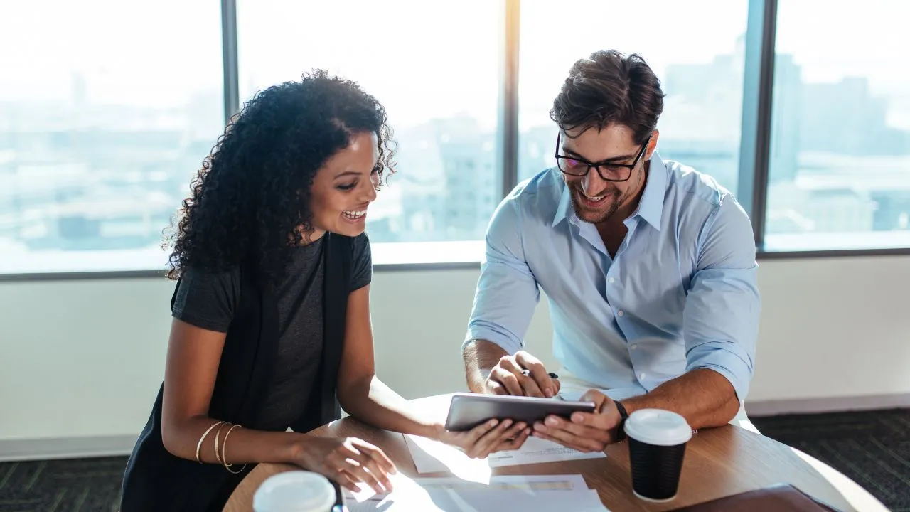Co investors working together at a desk