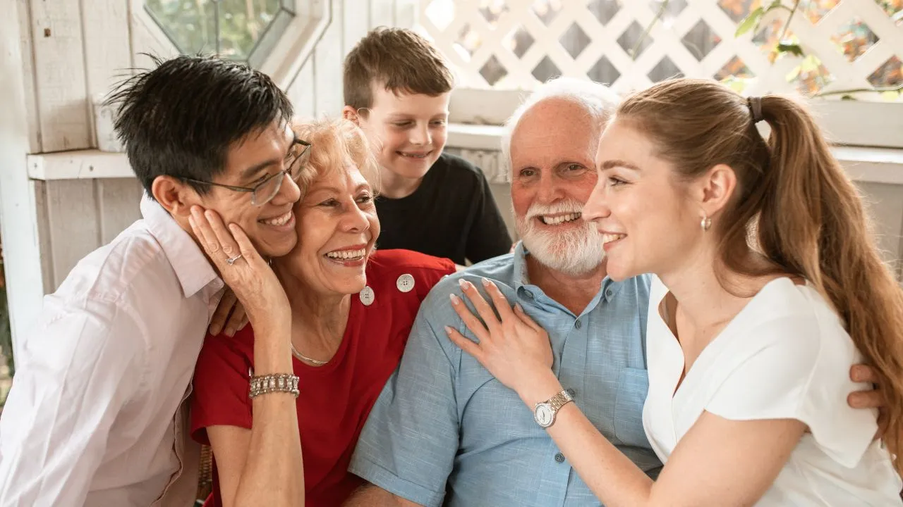 A happy family of 5 sitting on the family couch
