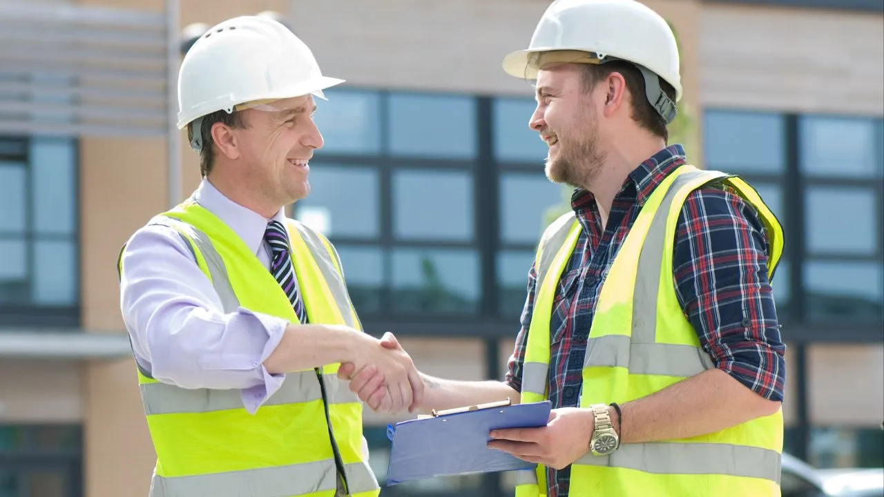Two independent contractors shaking hands