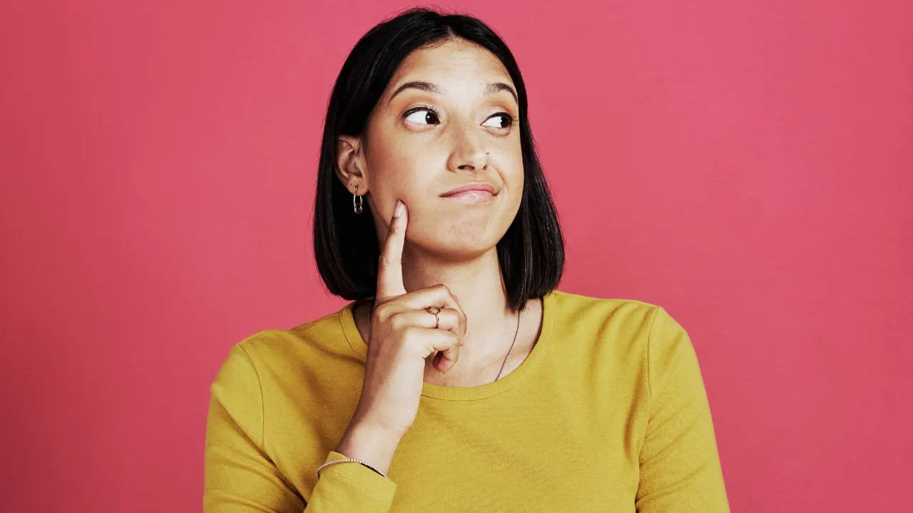 A woman thinking about potential answers to her questions