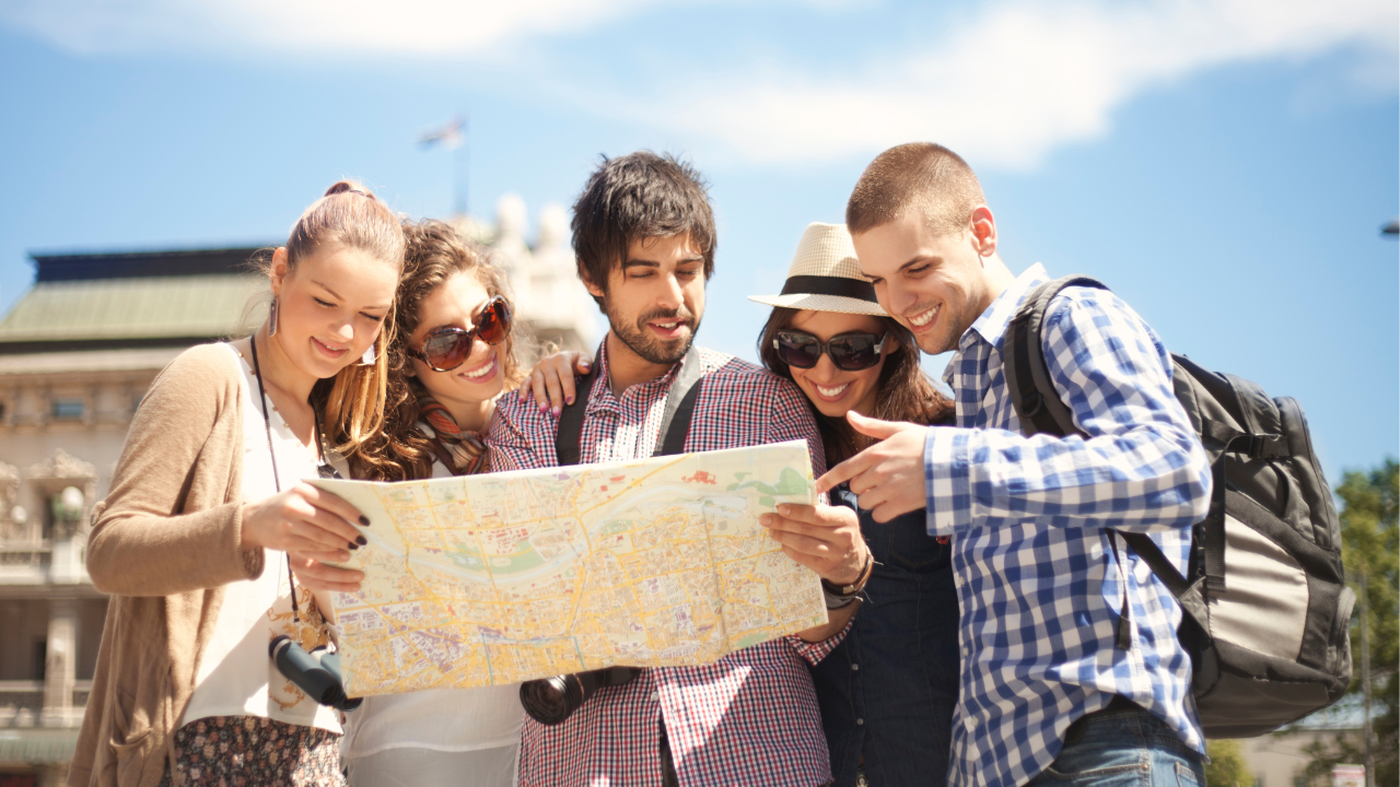 A group of travelers looking at a map