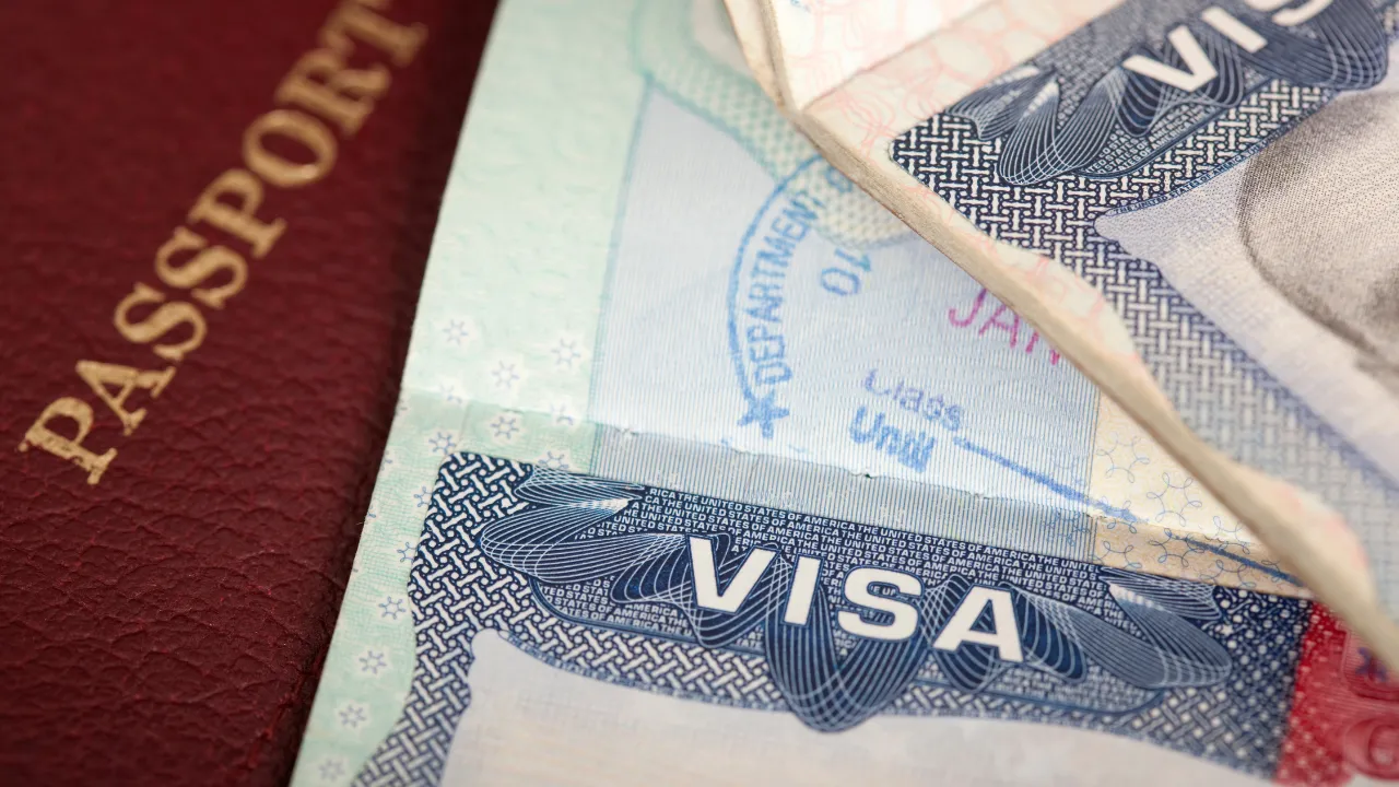 A passport and visa on a table