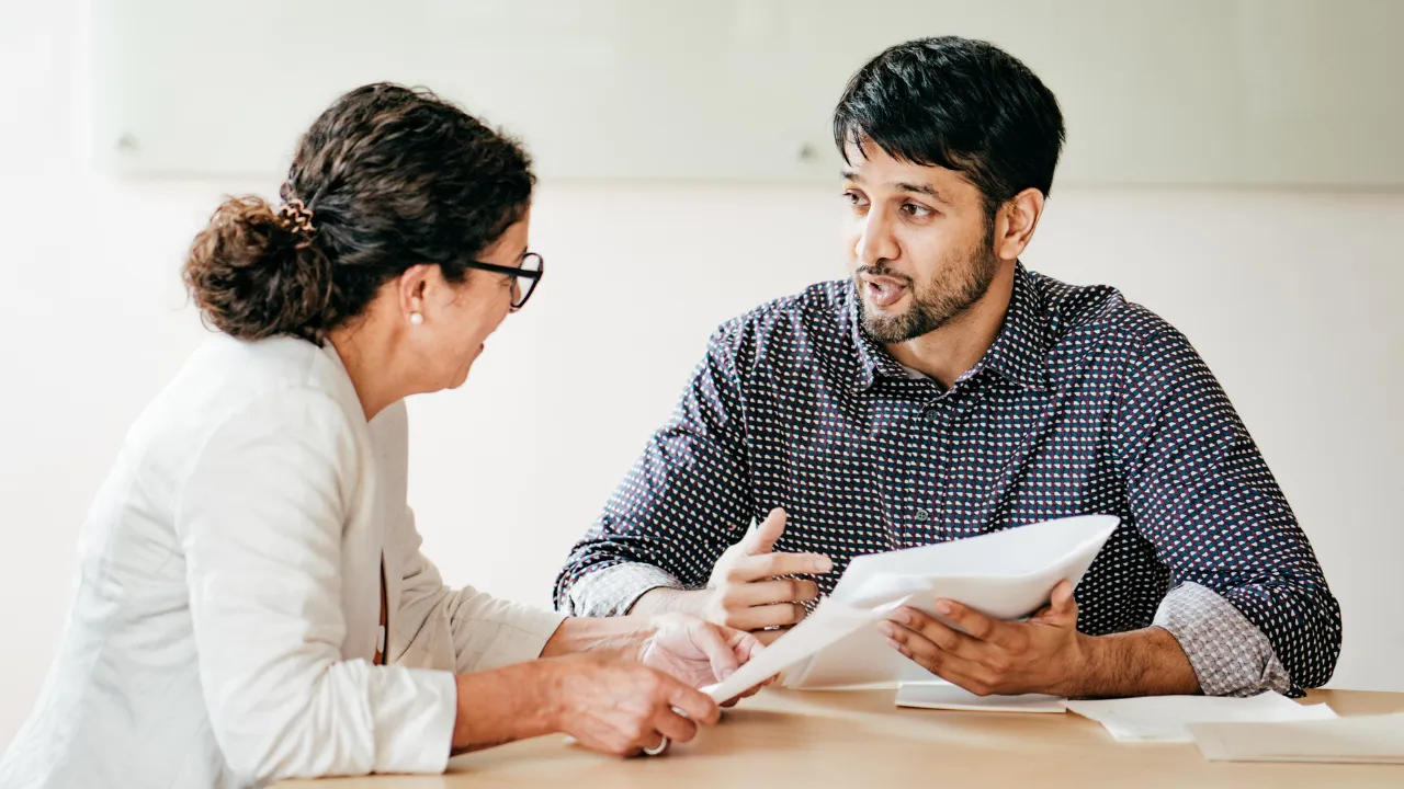 An employee and employer having a conversation