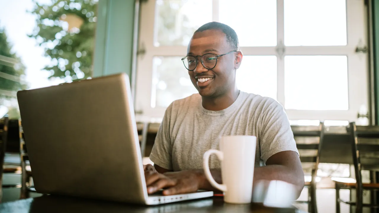 A man remote working at his laptop