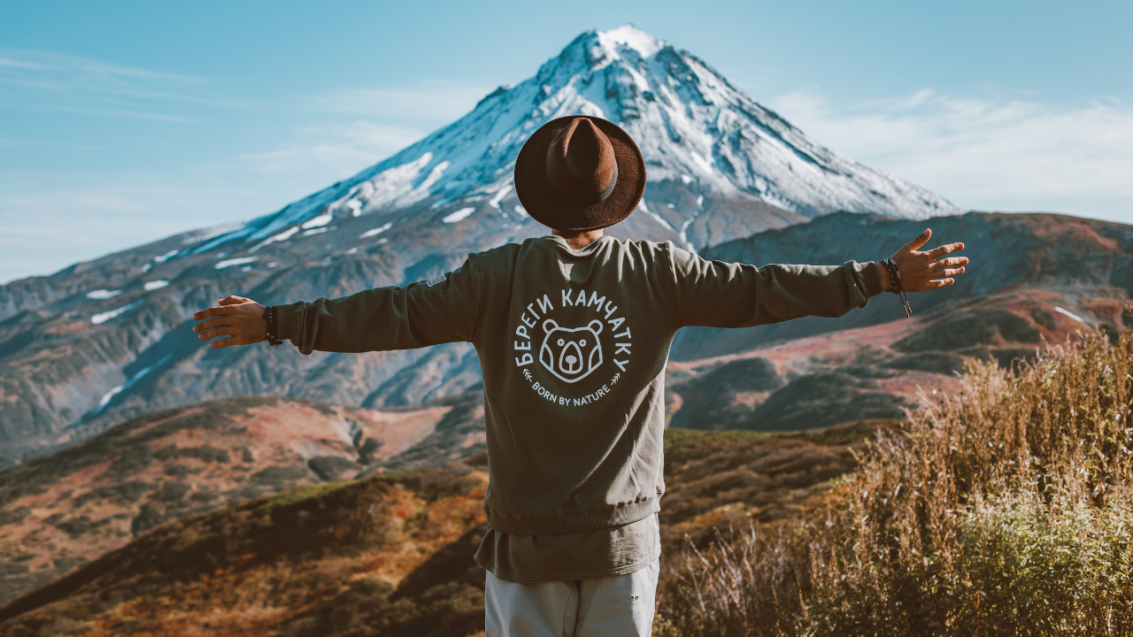 A man enjoying his travels in the mountains