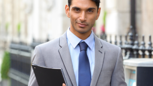 A business man holding a clipboard
