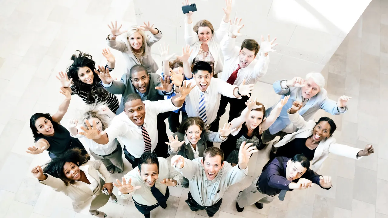 Happy office team celebrating a win