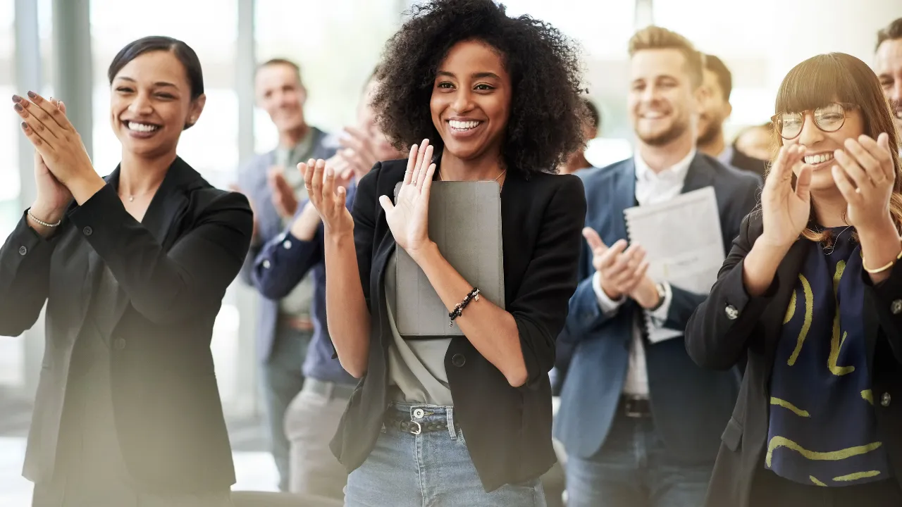 A team clapping after an approval