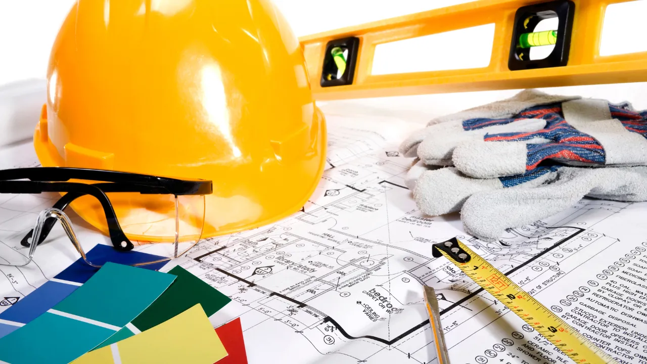 Home improvement tools and a plan on a table