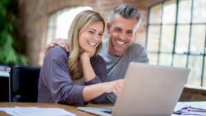 A happy couple looking at their recent green card approval