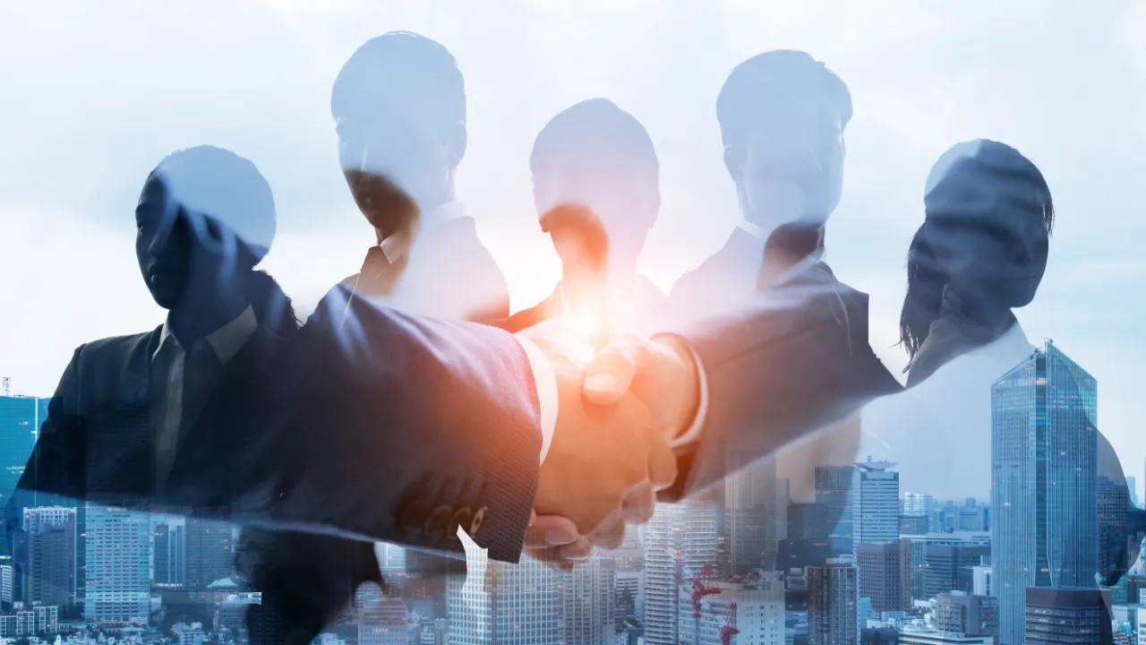 A groups of entrepreneurs shaking hands