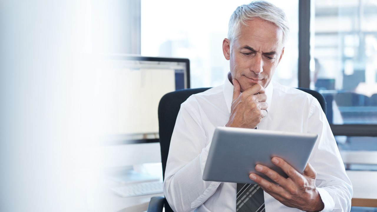 Entrepreneur looking at his options on a tablet