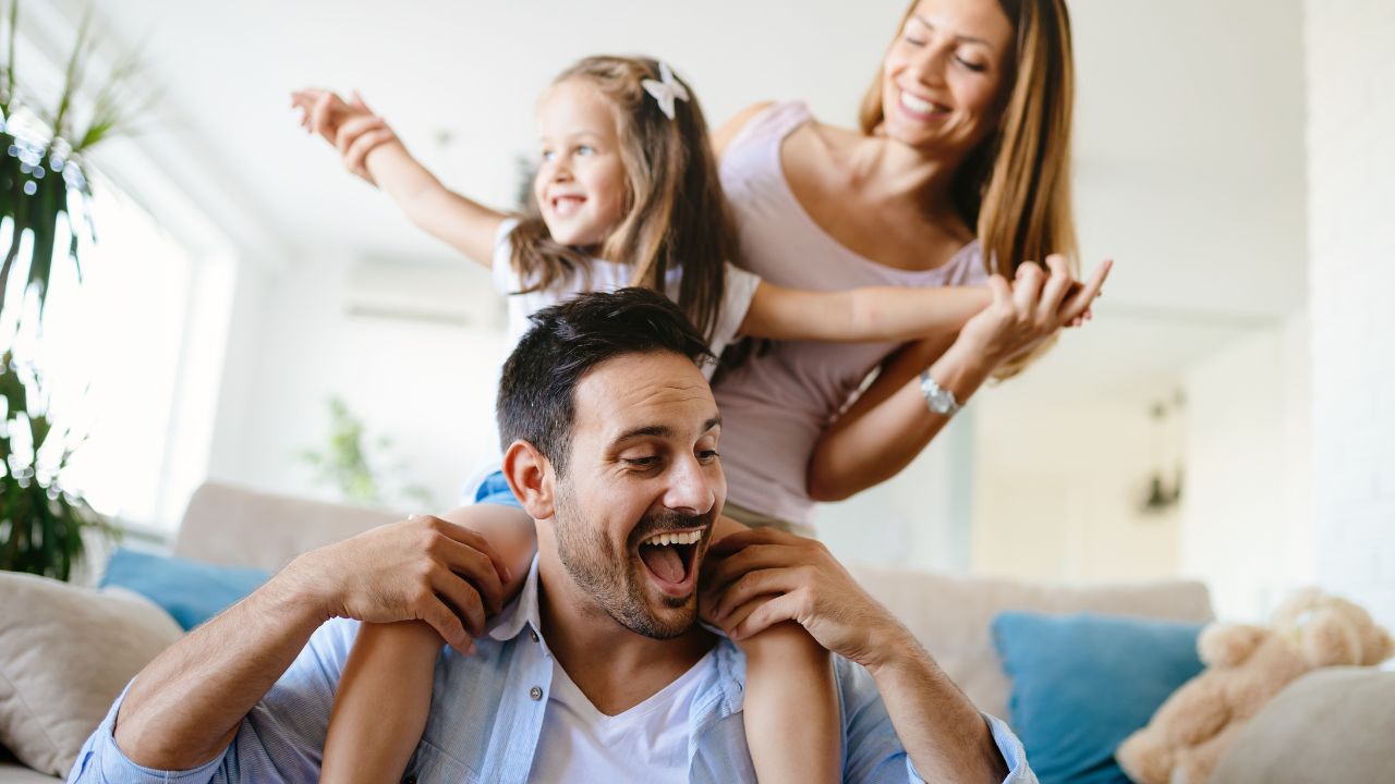 A happy family in their home.