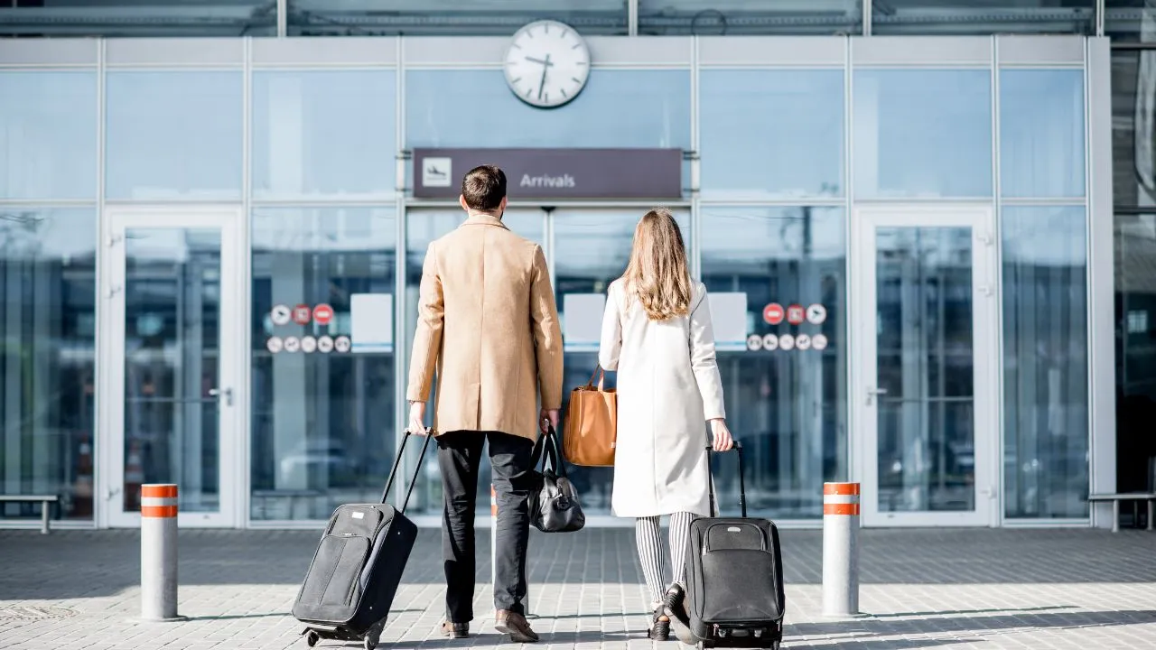A couple traveling at the airport