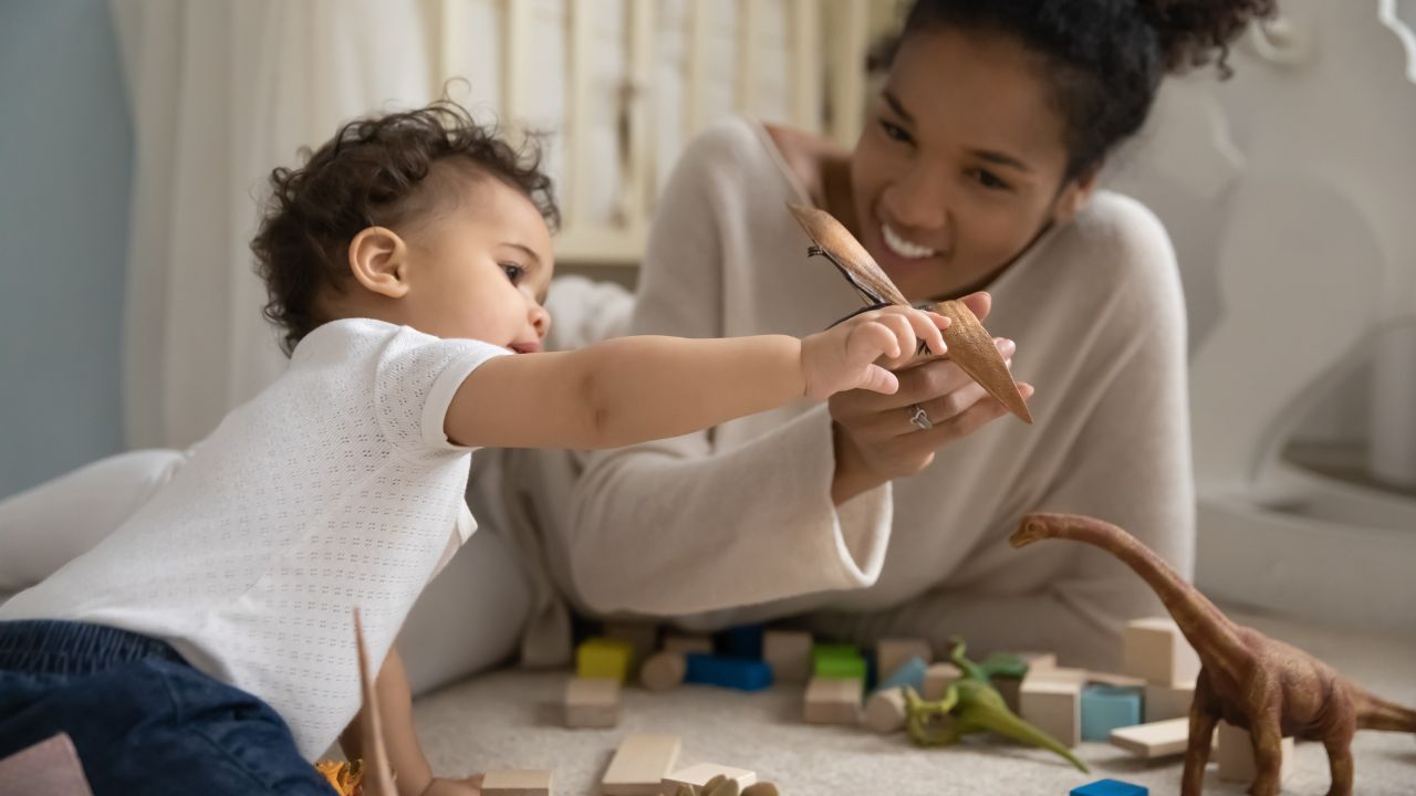 A nanny playing with a child