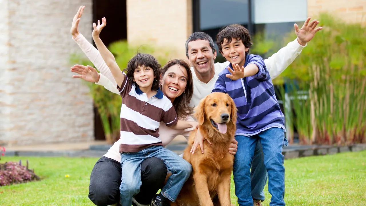 A happy family of 4 and a dog