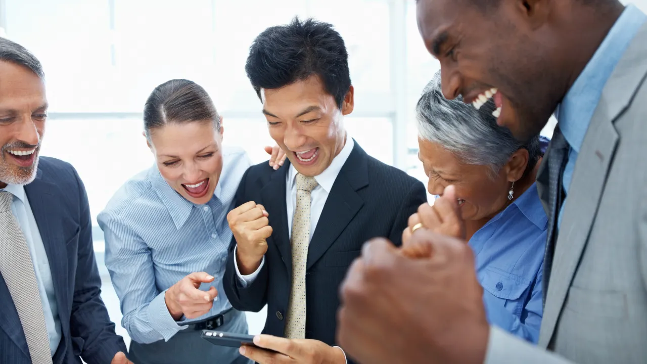 A group of professionals celebrating a win