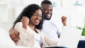 Two people celebrating an H1B lottery selection