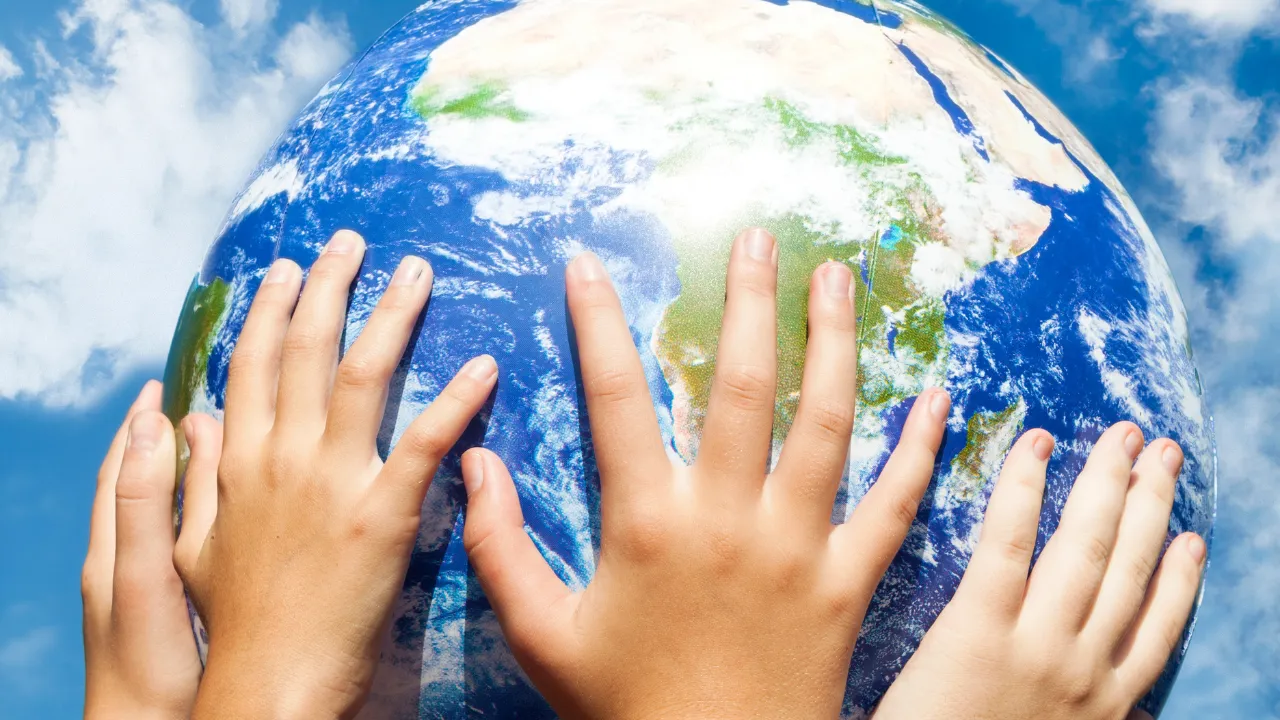 hands holding up the world