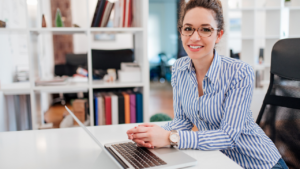 A corporate woman working on her laptop