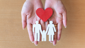 cut out of a family resting in a hand