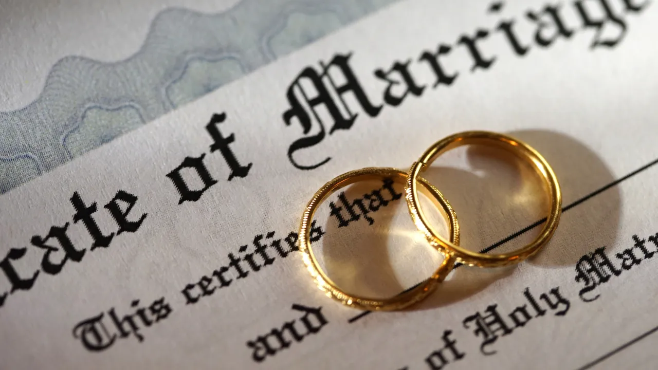 marriage certificate and rings