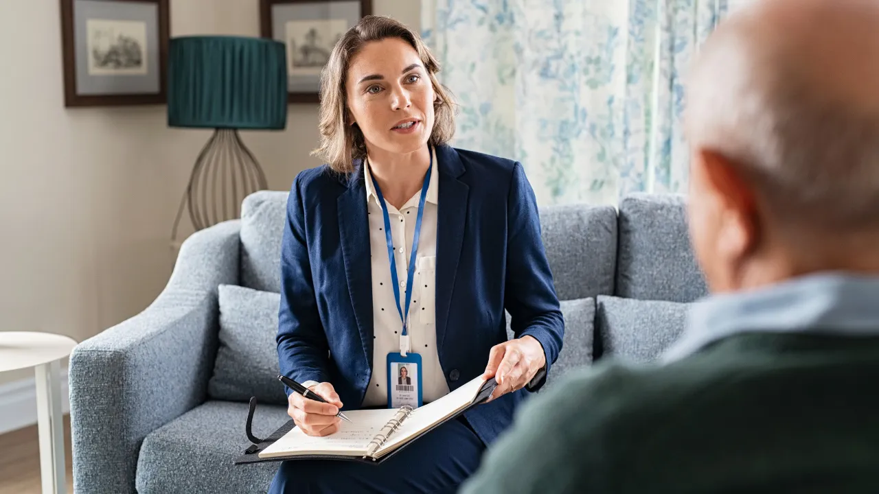 A social worker working with a patient