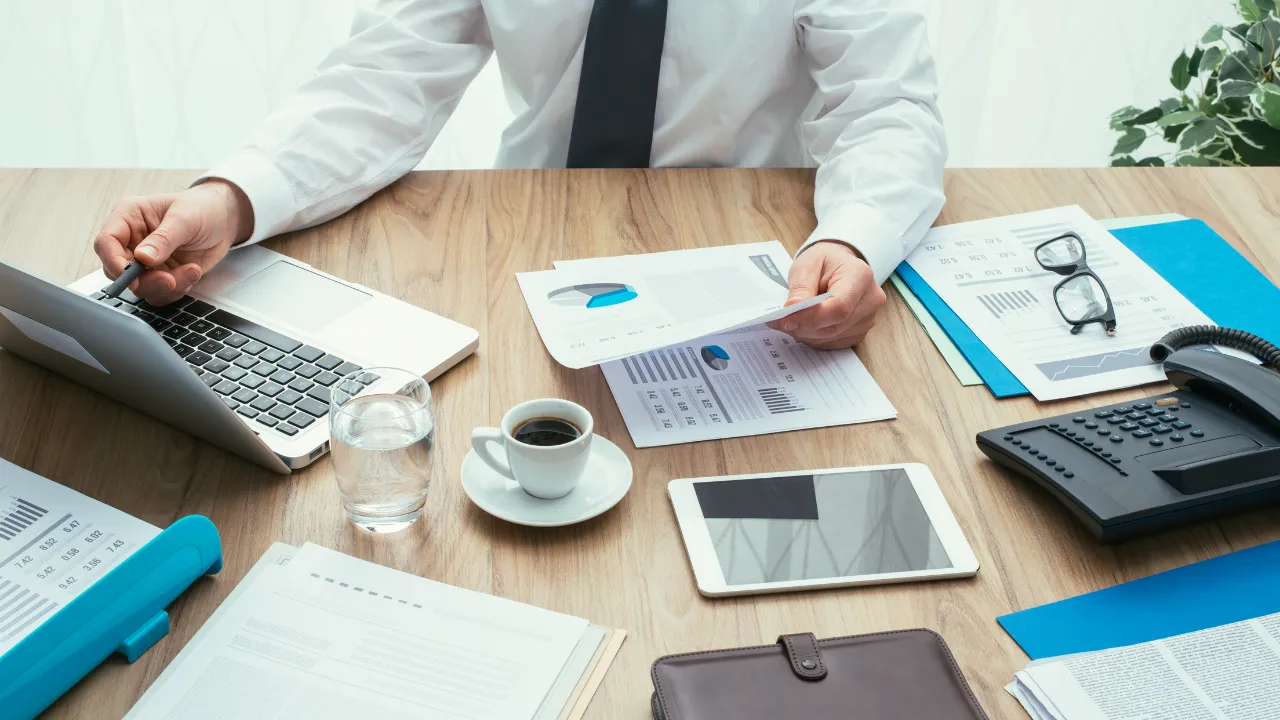 A busy office with a corporate business man at work