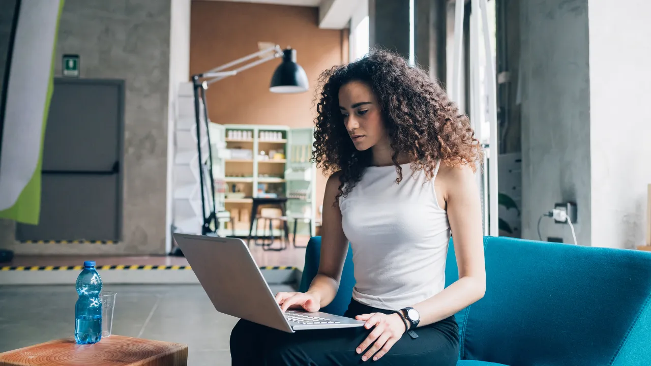 A woman working from an office workspace