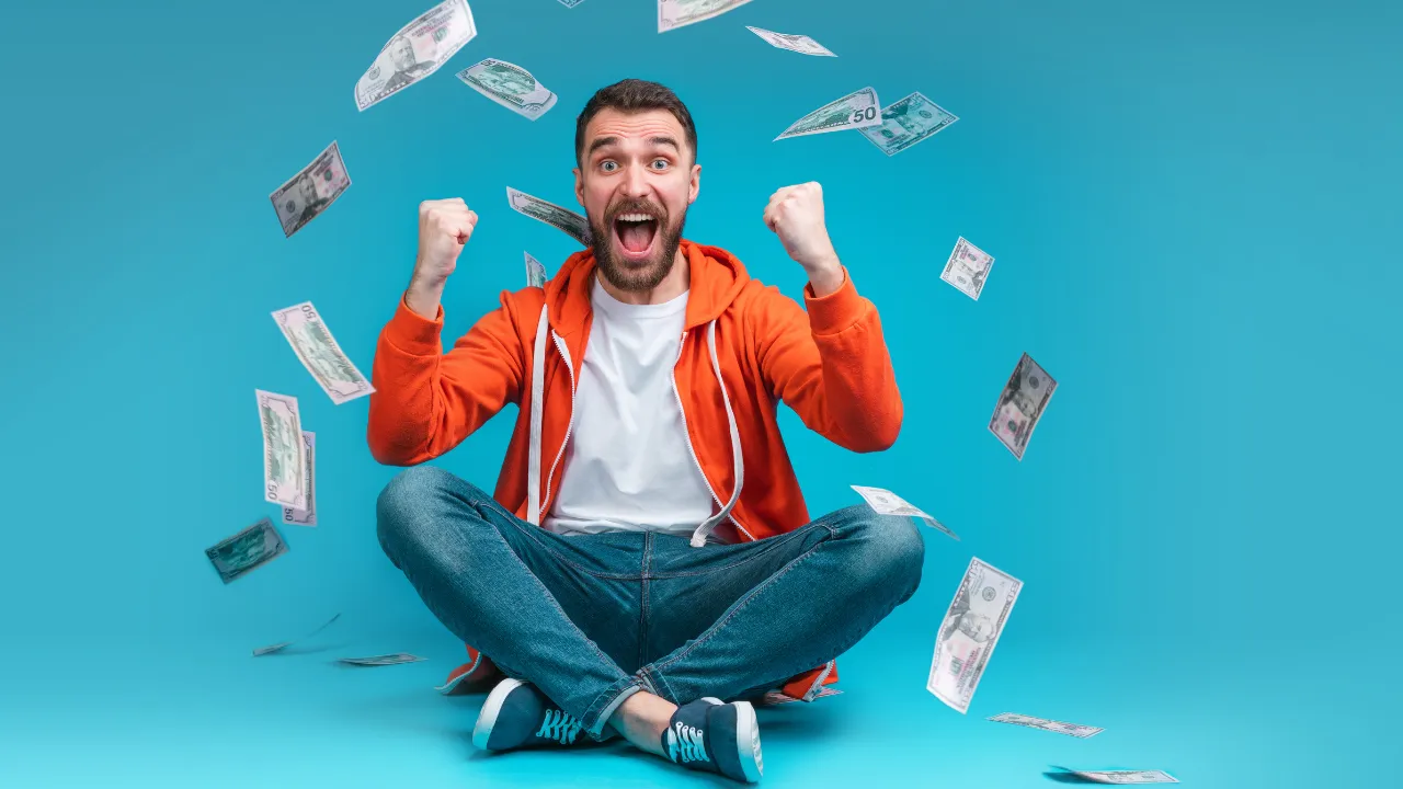 Aman celebrating winning the lottery