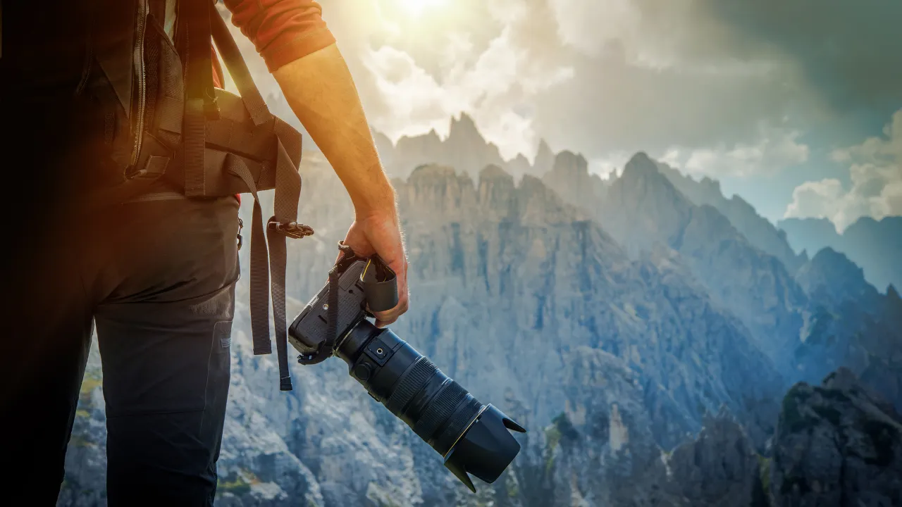 Photographer taking pictures of mountains