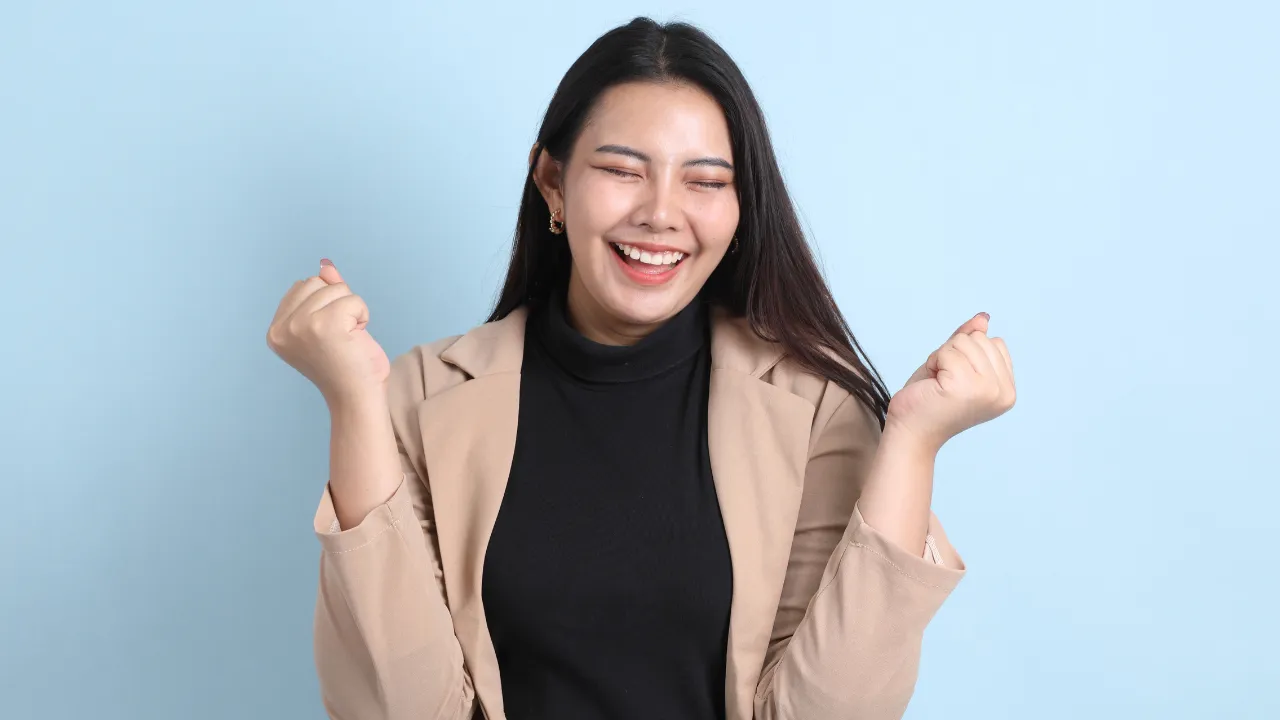 A woman celebrating a win