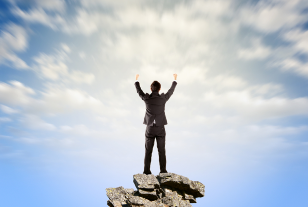 A business professional celebrating a win | Scott Legal, P.C. A business professional celebrating a win