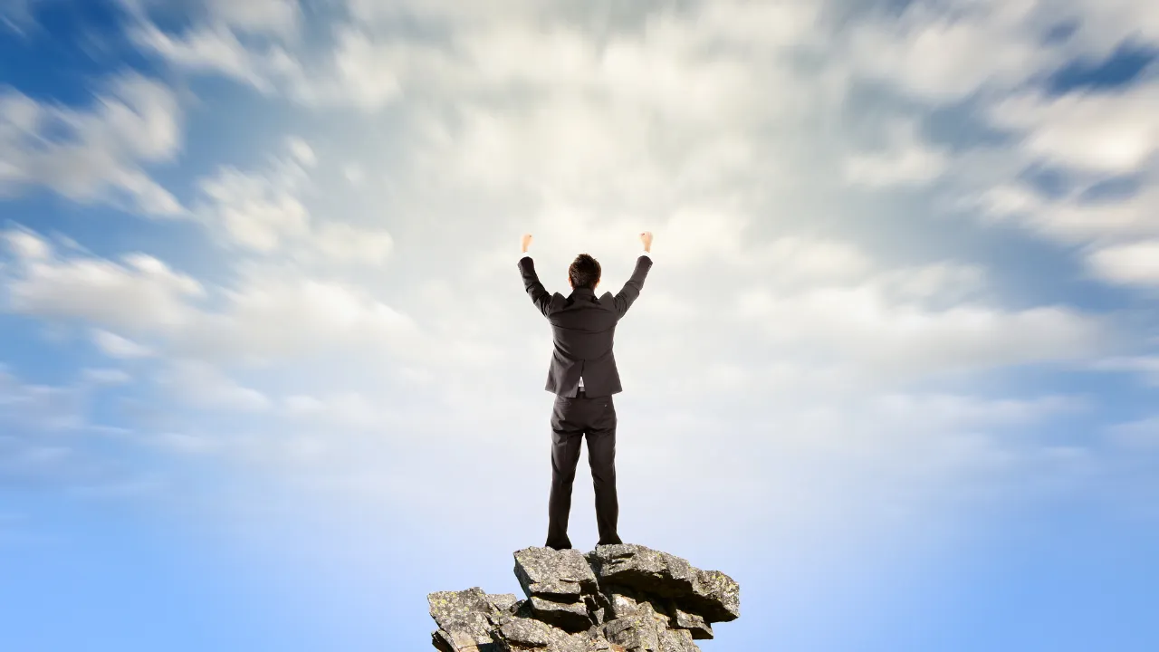 A business professional celebrating a win