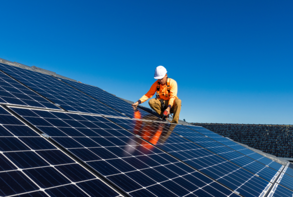 Image 2 | Scott Legal, P.C. A man installing solar panels