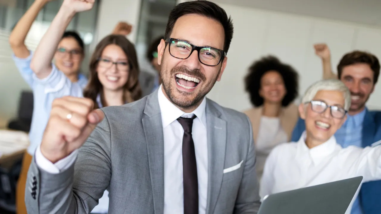 A man celebration success with his team