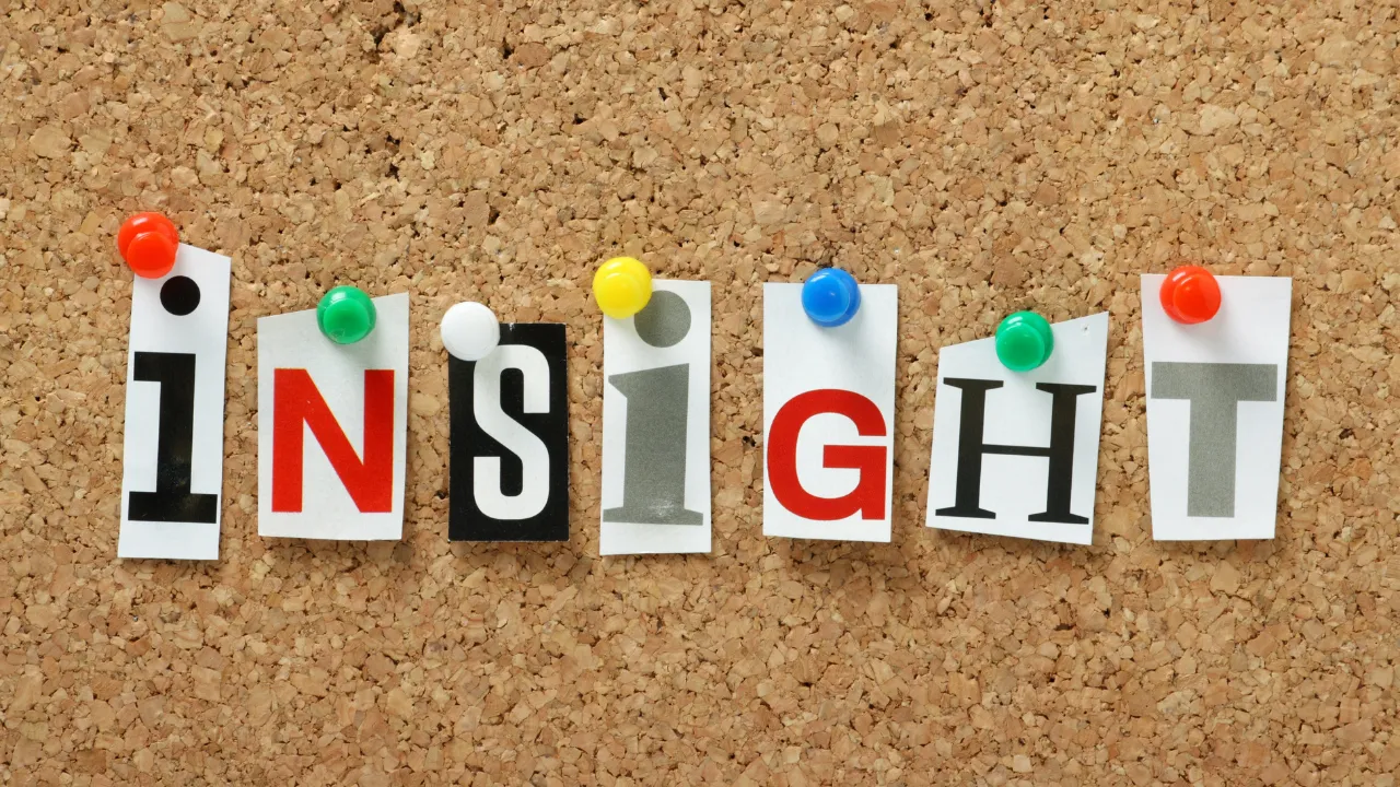 "insight" pinned to a cork board